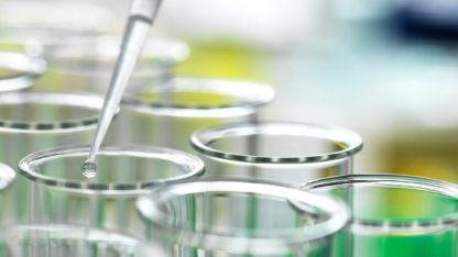 Several test tubes with a pipette, focused on genotoxic impurity analysis for ensuring pharmaceutical safety and quality.