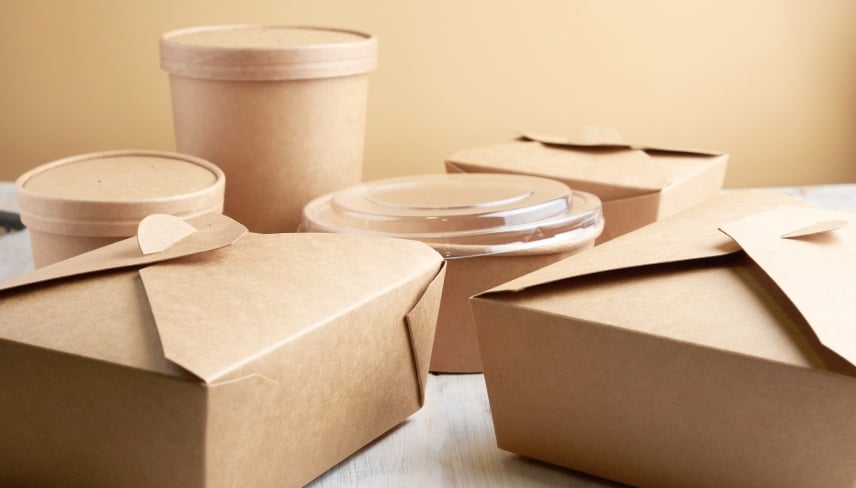 paper containers for takeaway food, isolated on a wooden table