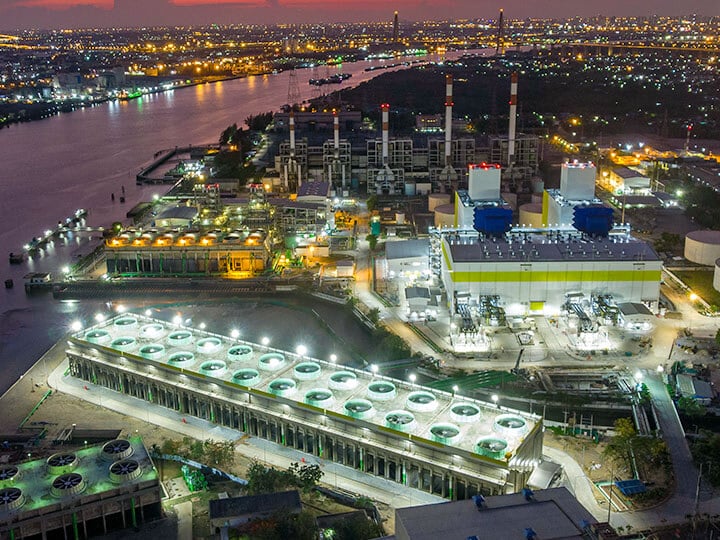 Aerial view of power plant on a river generating electricity for a large city