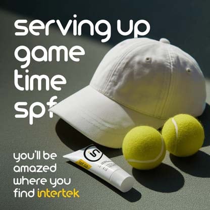 White baseball cap, sunscreen tube, and two tennis balls on a court with the phrase "serving up game time SPF" and Intertek branding.