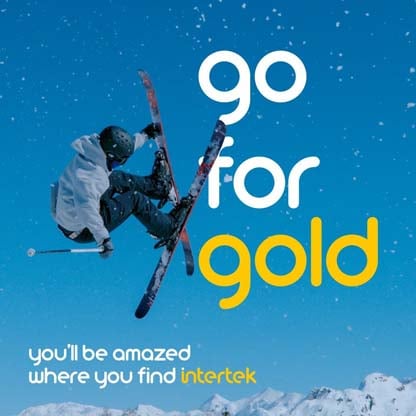 A snow skier caught at the height of their jump